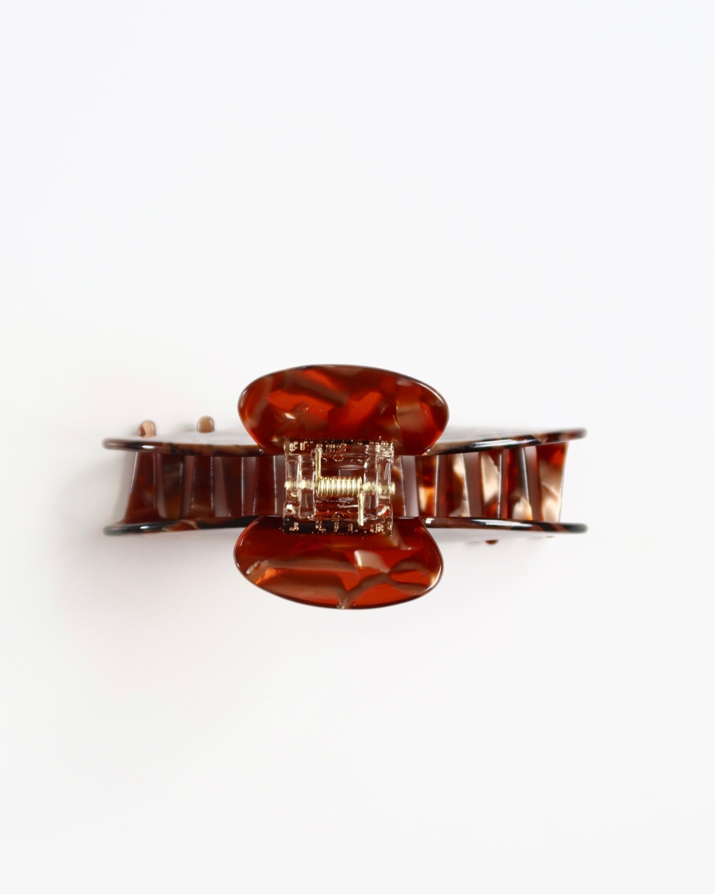 Brown hair clip on a white background