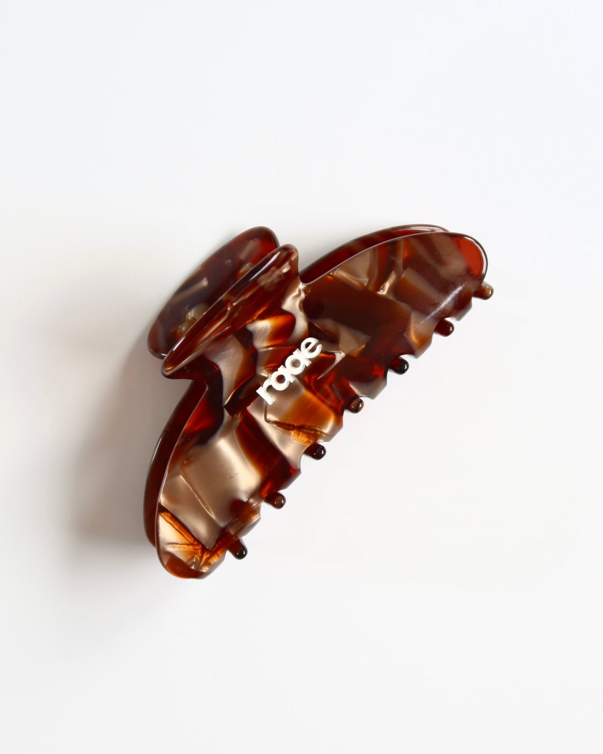 Brown hair clip on a white background